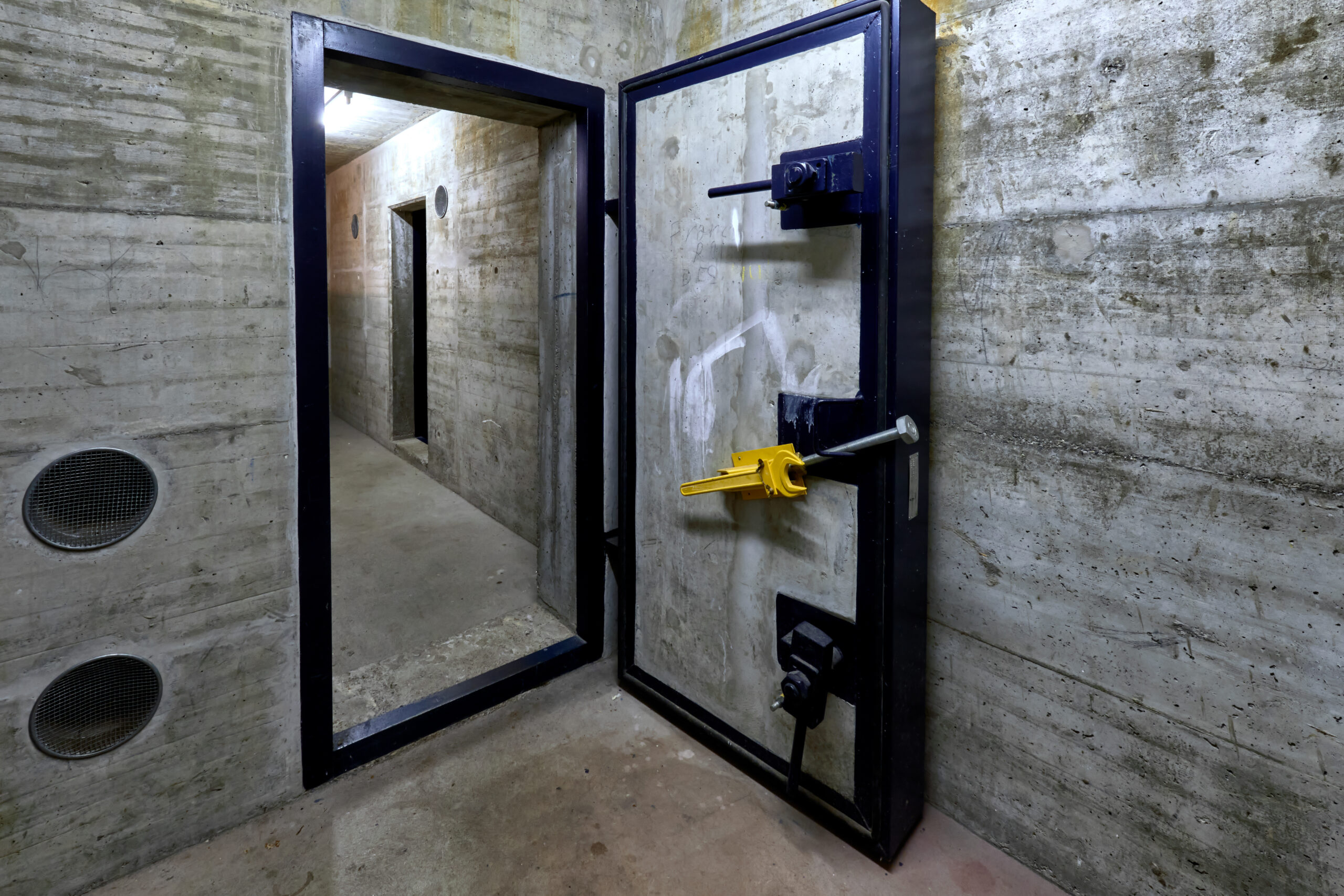 armored door of a public fallout shelter in an apartment building in Switzerland